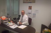 Person siting in desk in front of computer