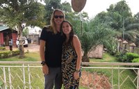 Two Peace Corps Volunteers stand together at Close of Service.