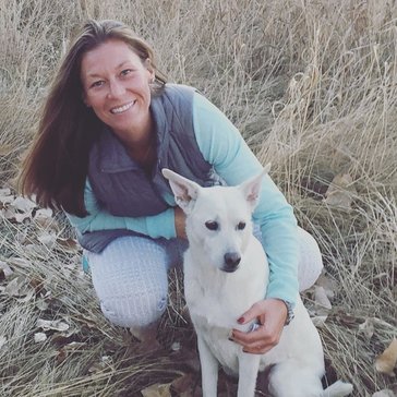 Karen, a veterinarian in Colorado, with her Peace Corps dog Callie.