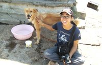 Hellen Phan and her dog in Uganda