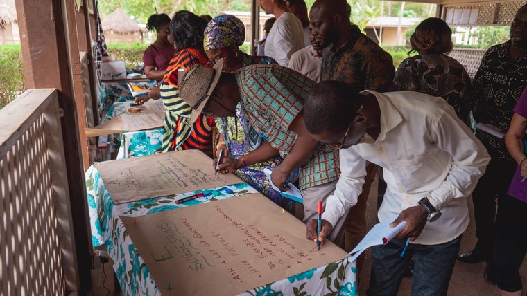 Volunteers, staff and counterparts during a training event