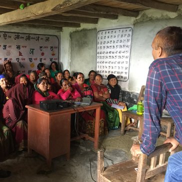 Sushil Aryal of the Bayarghari Livestock Service Center talks to workshop participants about intensive goat management practi