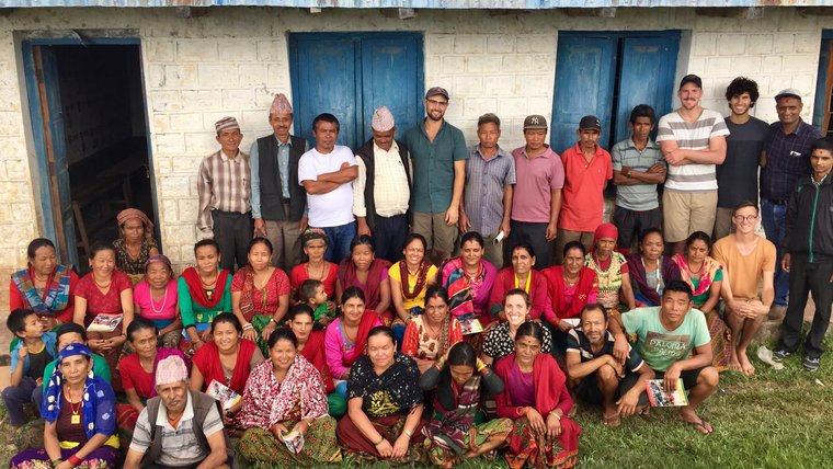 Participants of the Intensive Management and Improved Genetics in Goats workshop gather outside for a photo.