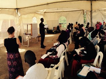 Peace Corps Volunteers facilitating a business plan session.jpg