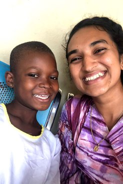 Volunteer with a child in Ghana