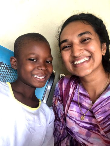 Volunteer with a child in Ghana