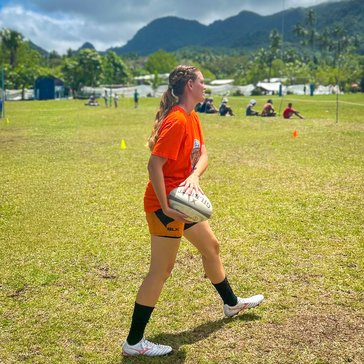 Emily practices with the village girls' rugby team in Fiji.