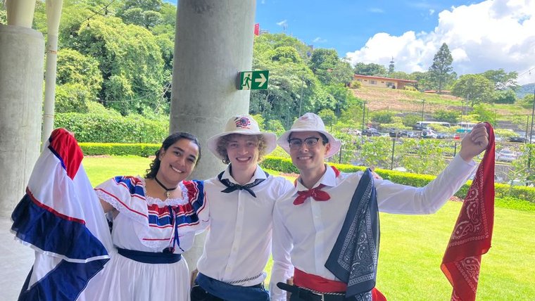 Newly sworn-in Volunteers William, Hanna, and Camden, after presenting a typical Costa Rican dance that they learned.