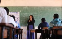 Fiorella at the front of the classroom teaching a lesson on English