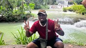 pcv Ptah Asabi flashes peace signs in Jamaica