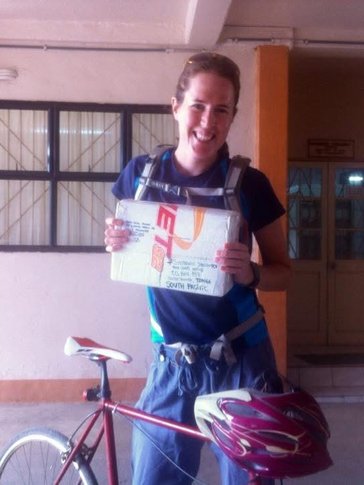 Steph rides her bike to the Peace Corps office in Tonga.