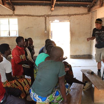 Education Volunteer Andrew teaches in a Malawian classroom.