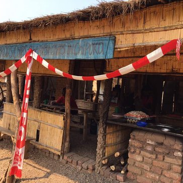 A small half indorr, half out door room where Malawians make and sell "chippies" or french fries.