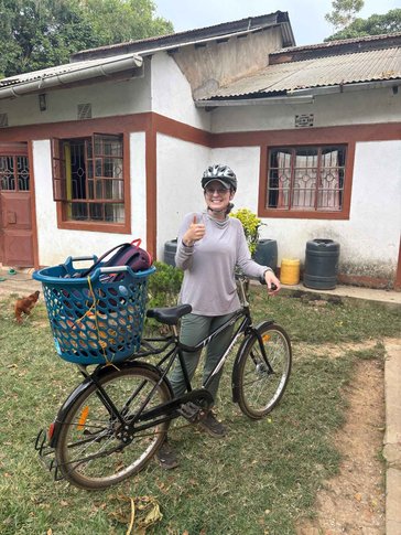 Peace Corps Volunteer Nicole uses a bike to get around in Kenya.