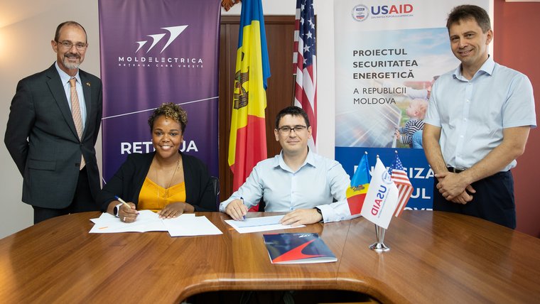Larcus participates in a signing ceremony for an initiative to improve Moldova’s transmission system infrastructure.