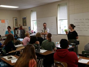 Rachel and Evan speaks to a class at Rachel's old high school, which is also her partner school with World Wise Schools