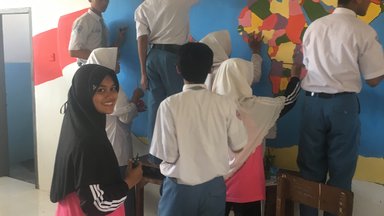 Students painting a mural