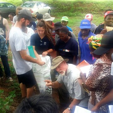Volunteers participate in a permagarden training along with their counterparts.
