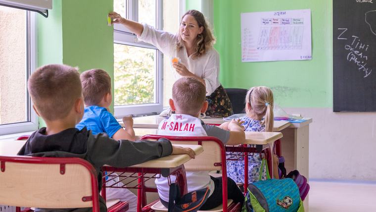 An Education Volunteer engages young students in Kosovo.