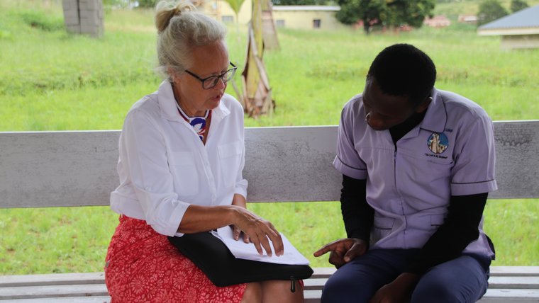 Peace Corps Response Volunteer with a student