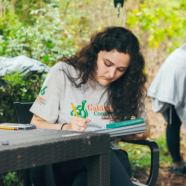 Lauren takes notes as Galápagos land iguanas are prepared for relocation.