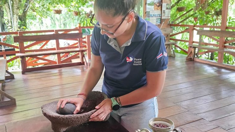 Isabela prepares food in Costa Rica.
