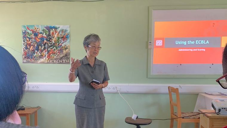 Jian demonstrates literacy teaching techniques.