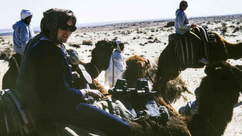 Director Olsen rides a camel while serving as a Peace Corps Volunteer in Tunisia.