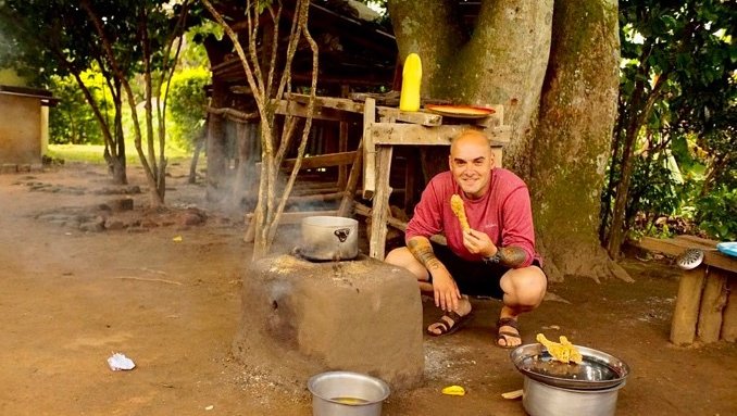 John enjoys cooking during his free time in Uganda.