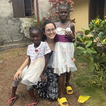 Julia with two neighbor kids, Alice and Marian, during a community celebration