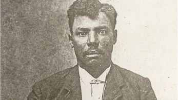 Old black and white portrait photo of a black male