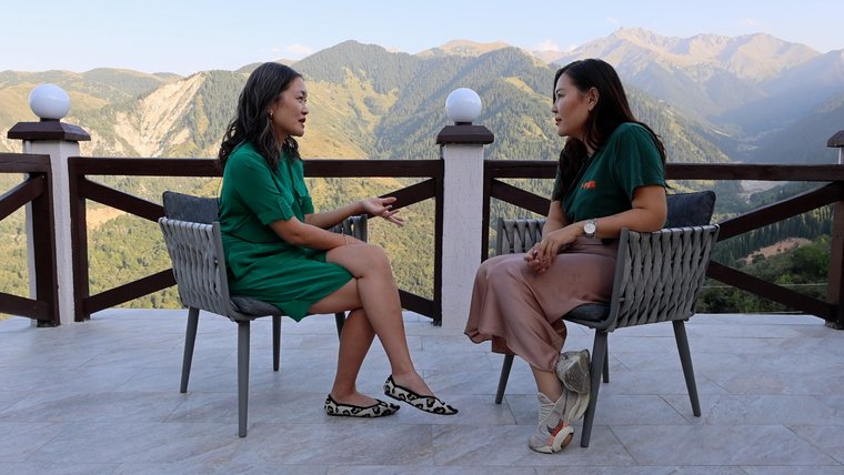 A former female Peace Corps Volunteer meets with her former mentee, a woman from Kazakhstan.
