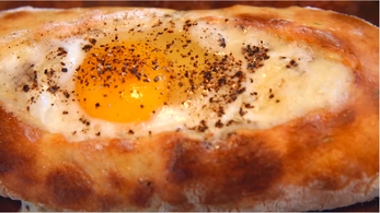 Khachapuri food from Georgia. Egg in bread.