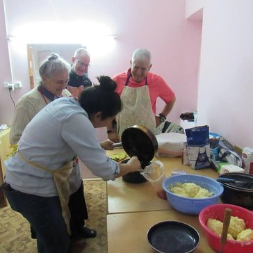 Some Volunteers learning how to make khachapuri (cheese-filled dough) and lobiani (bean-filled dough).