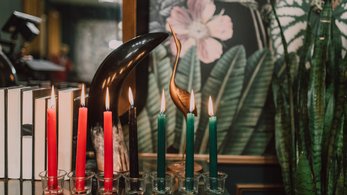 A kinara with lit candles