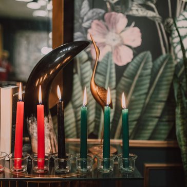 A kinara with lit candles