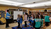 RPCVs speak to a Girl Scout troop during World Thinking Day