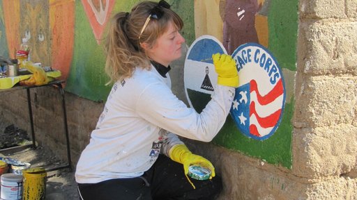 Laura works on the Peace Corps mural.
