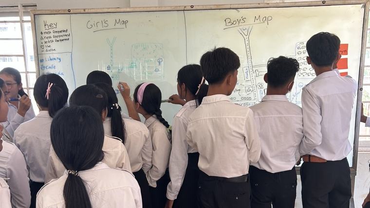 Cambodian students work on a project in their school library.