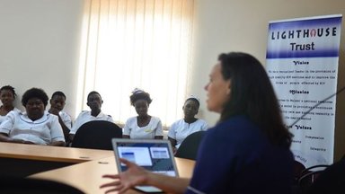 A female nurse presents to 6 other women