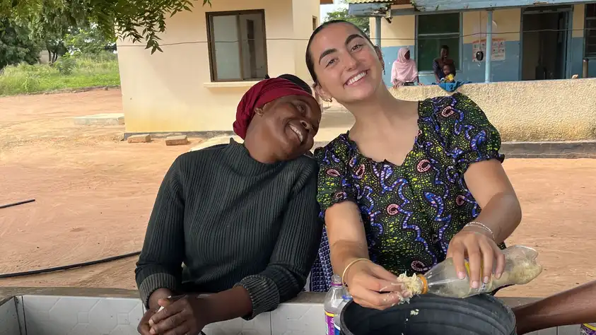 Liora with her counterpart, Mama L., teach soapmaking to mothers at the local clinic.