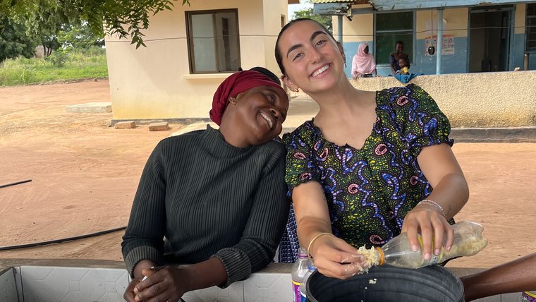 Liora with her counterpart, Mama L., teach soapmaking to mothers at the local clinic.