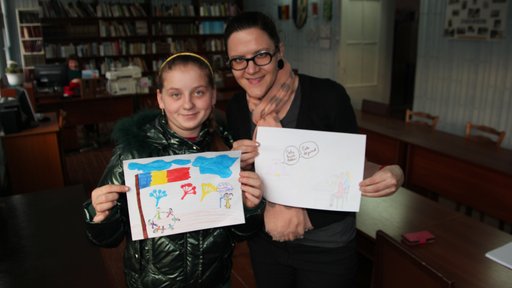 Local youth Cristina participates in an art hour, drawing pictures to share with Americans about Moldova.