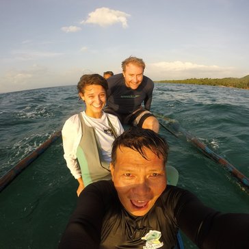 Morgan travels by boat to perform surveys of the local marine protected areas, with her coworkers Drew Sullivan (back, fellow