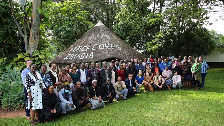 The Peace Corps Zambia staff and the five reinstated Volunteers.