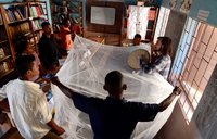 Spreading out a mosquito bed net