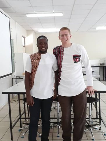 Volunteer and Counterpart facing camera