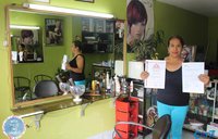 Maria, a participant of "With These Two Hands," in the shop that she owns and operates.