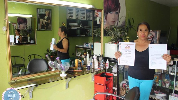 Maria, a participant of "With These Two Hands," in the shop that she owns and operates.