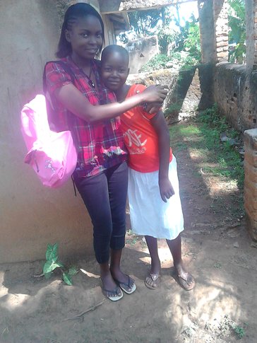 A women hugs a young girl in Africa